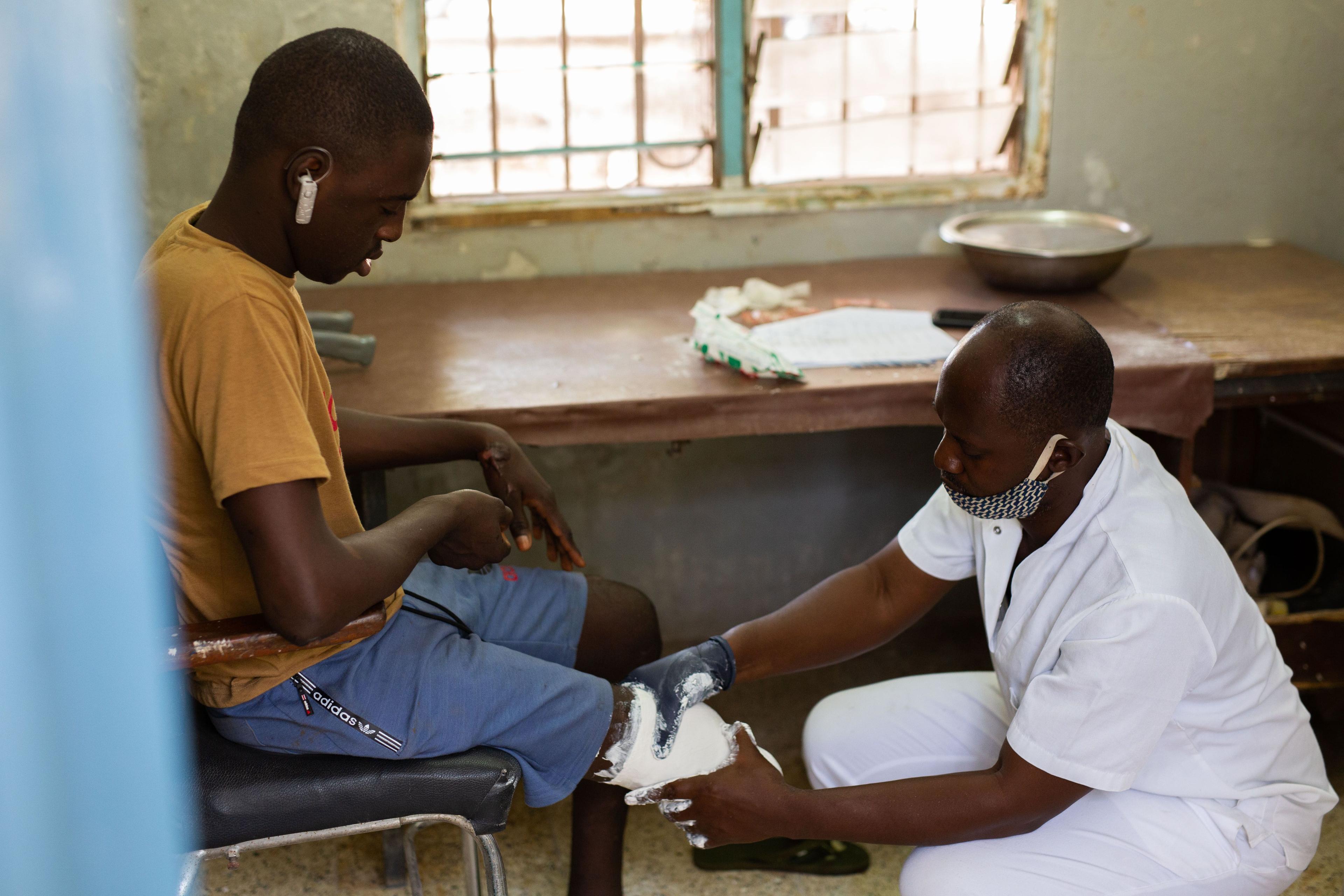 Amputees in The Gambia receiving recycled prosthetic legs from the UK STAND formerly Legs4Africa.