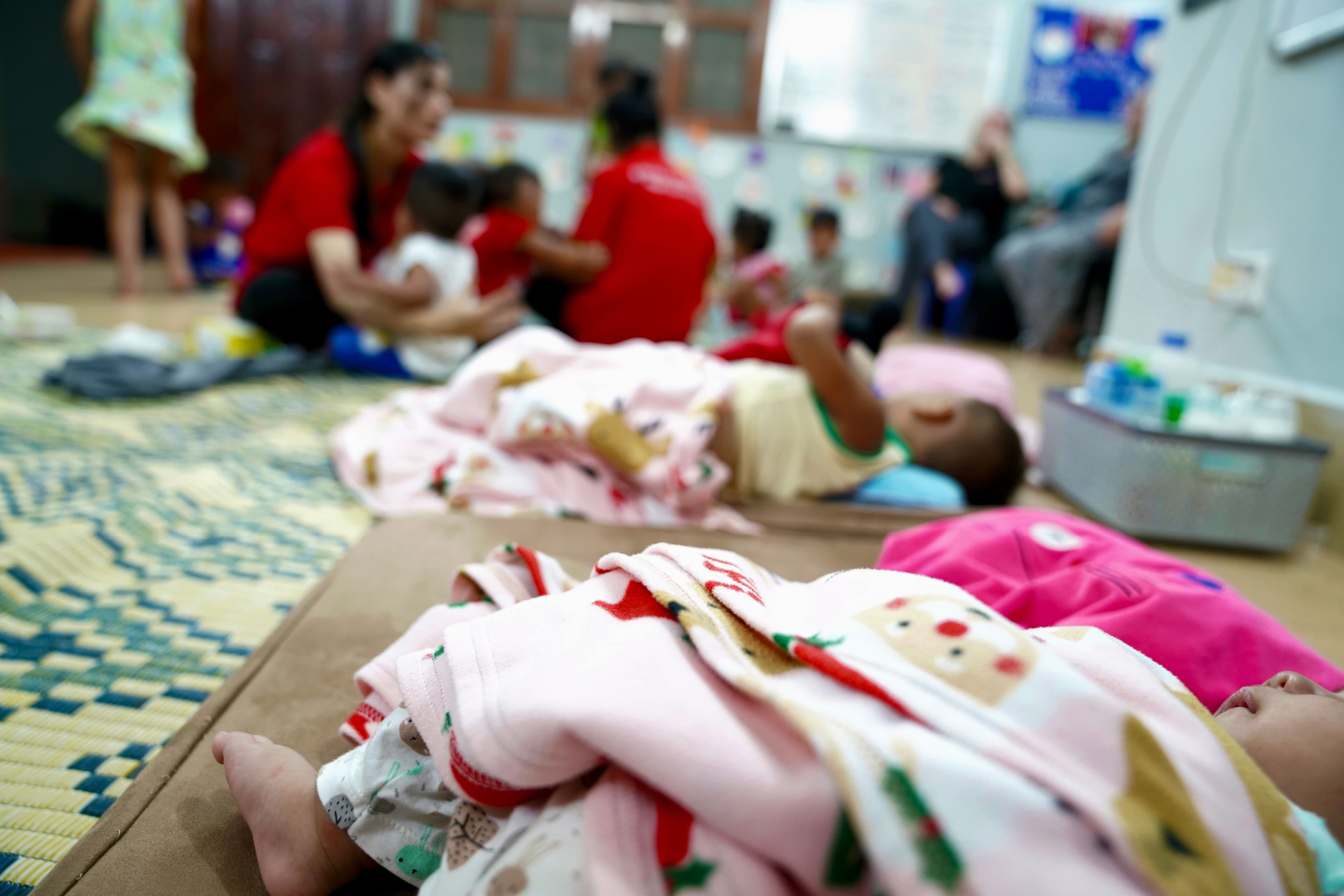 Cambodian children sleeping at a childcare center in Phnom Penh