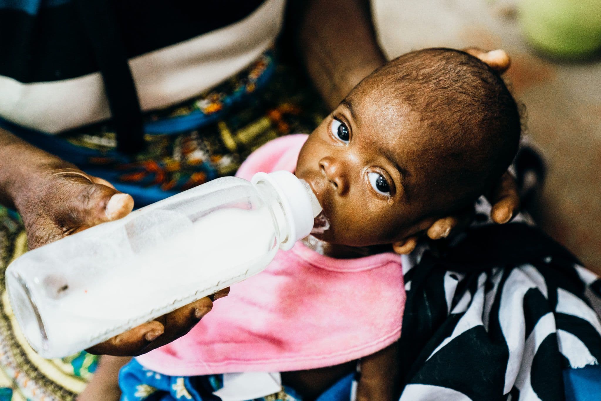 Little baby getting therapeutic milk at Angolan malnutrition clinic