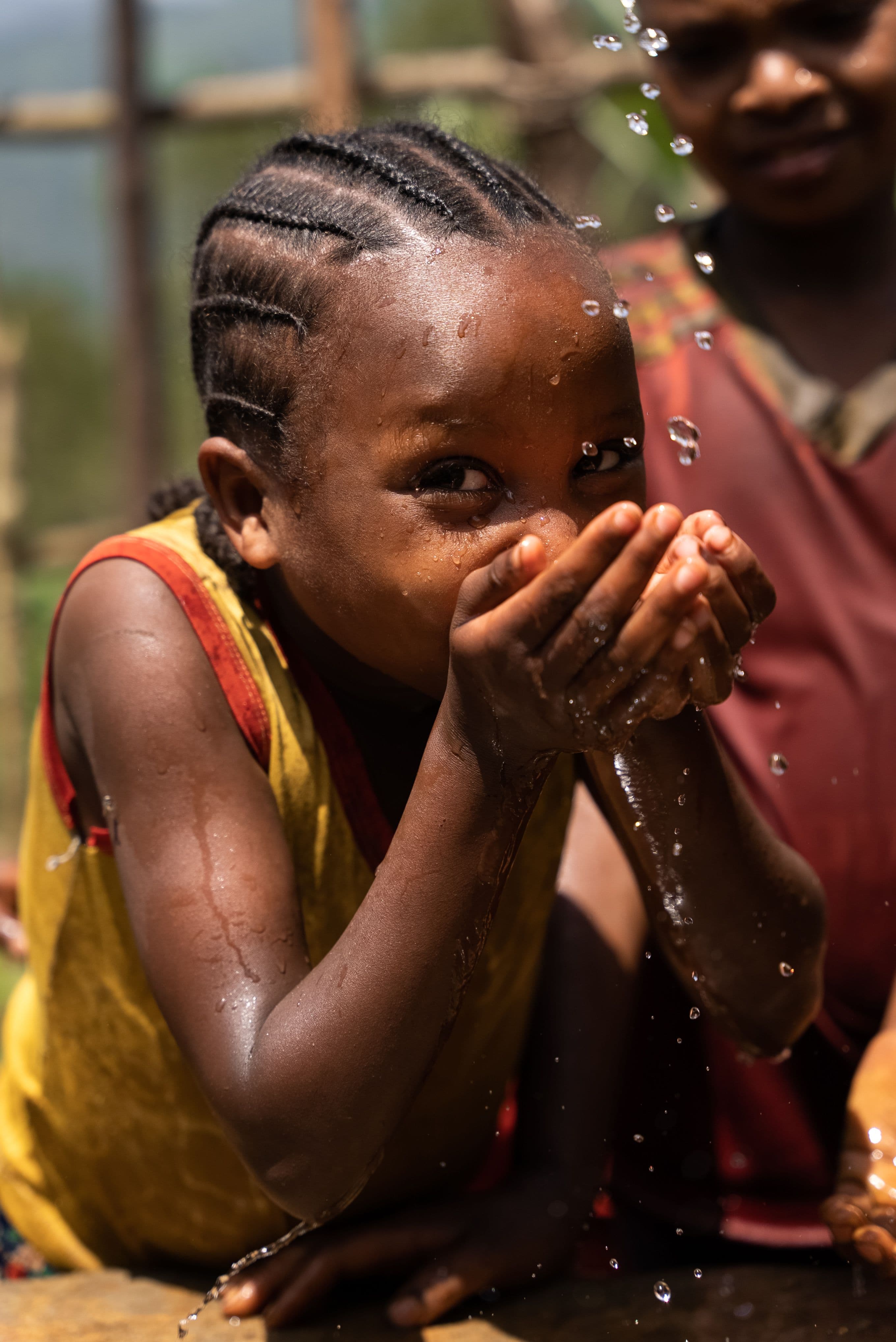 Child in Ethiopia enjoy clean water from the new well