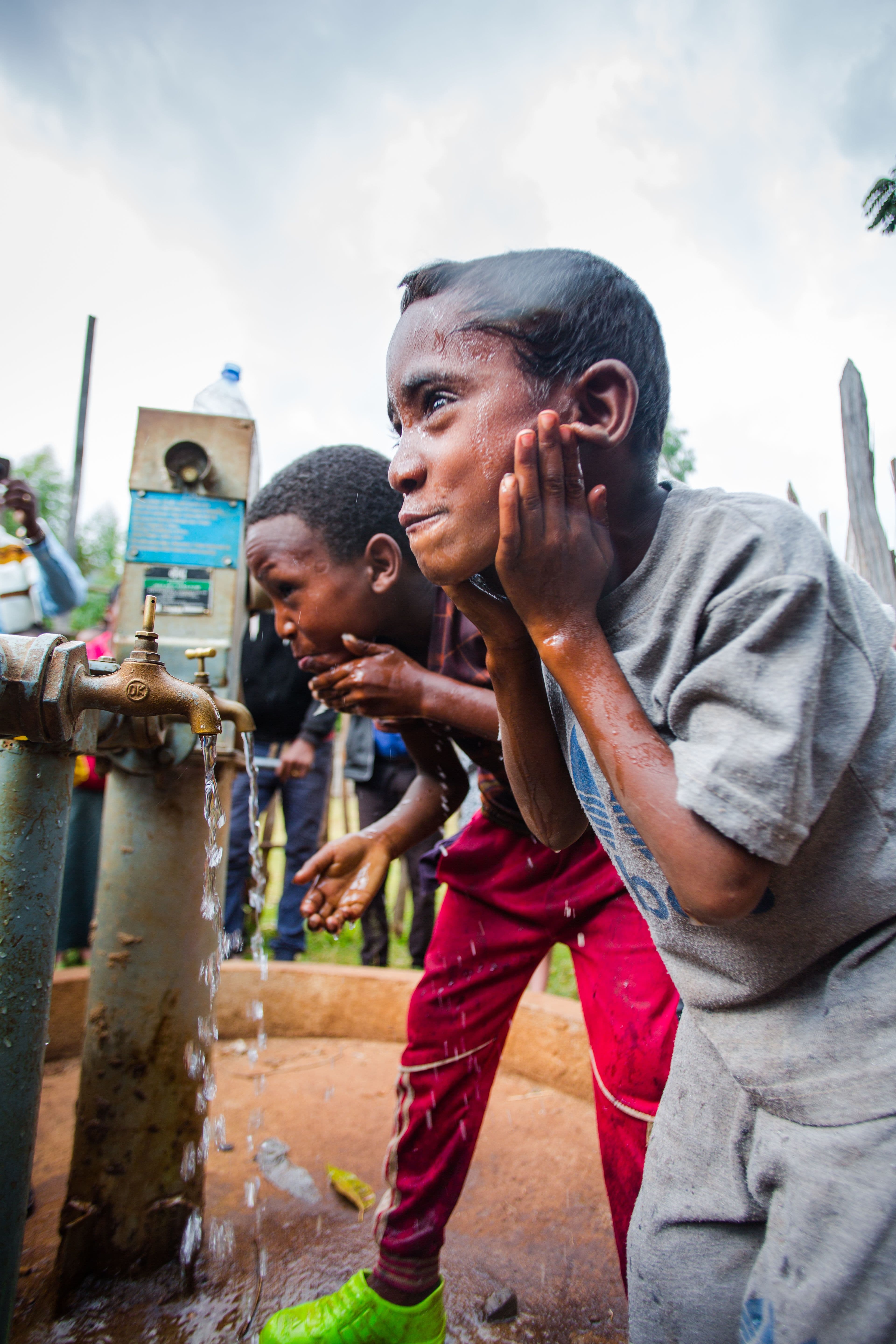 Ethiopian boy enjoys clean water from new well