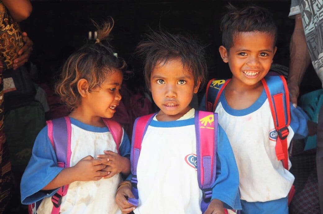 Indonesian children receive book bags of blessing