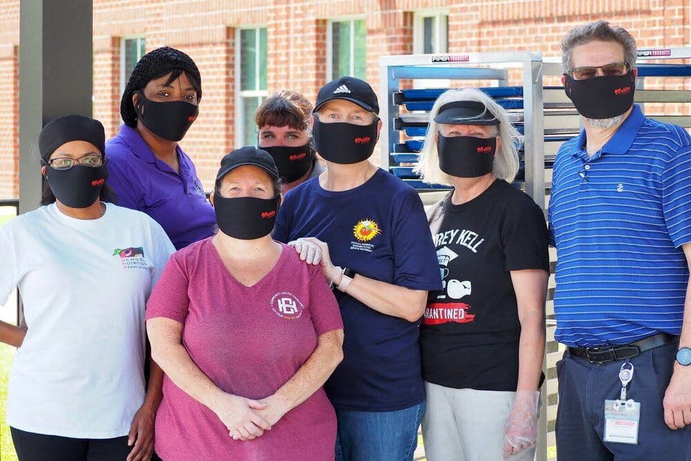 CMS staff receive mask during covid pandemic
