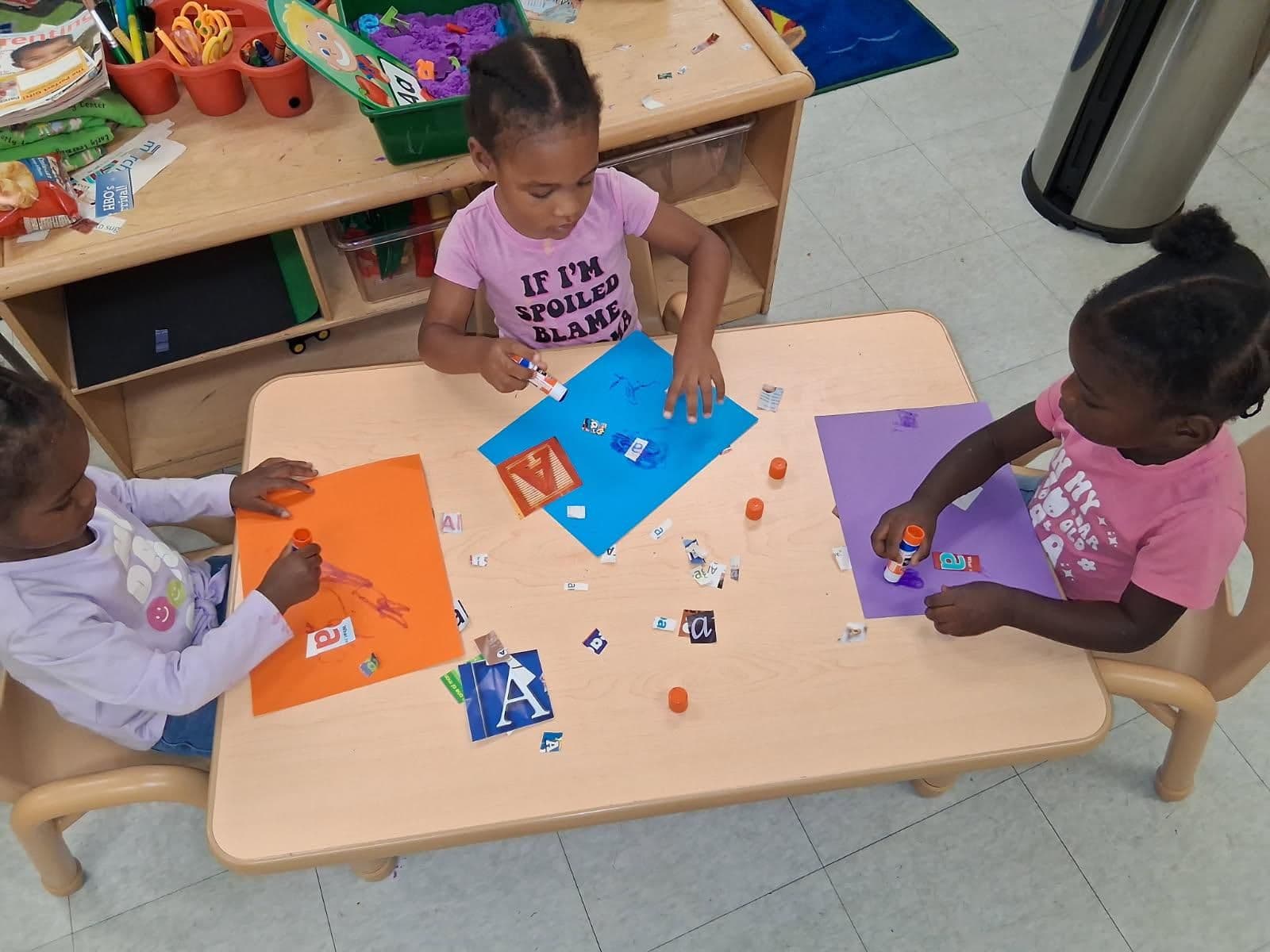 Little students writing and drawing at Charlotte, NC, school